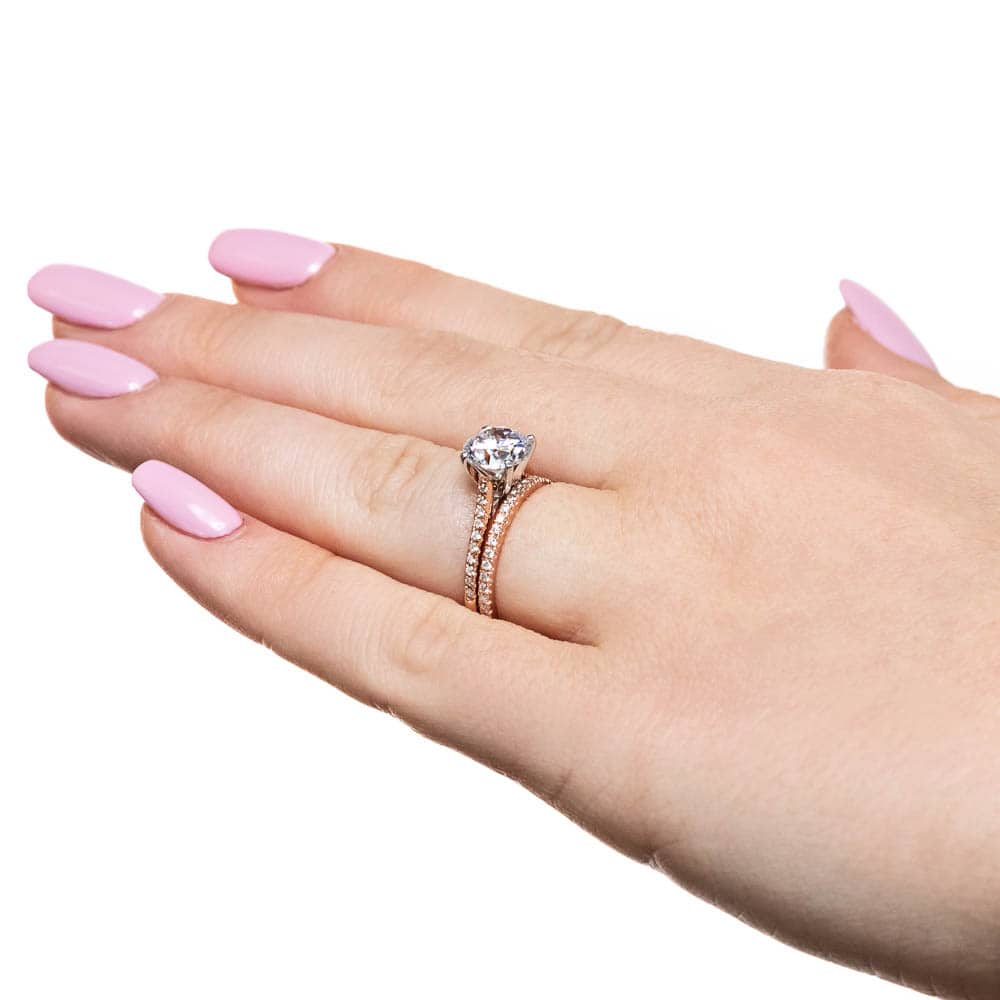 Idyllic Wedding Ring set shown here with a round cut Lab-Grown Diamond in rose gold 