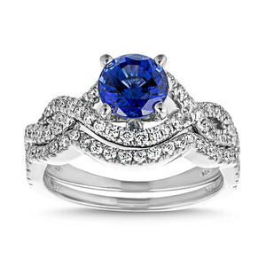Blue sapphire wedding ring set with wavy twisted band design set with accenting diamonds in 14k white gold