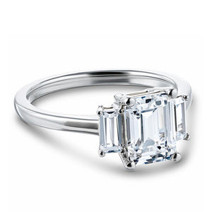 Ethical three stone engagement ring with 1.75ct emerald cut lab grown diamond center stone and two baguette cut diamond side stones in 14k white gold