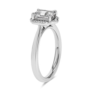 halo engagement ring with 1 carat emerald cut center stone set in 14k white gold metal