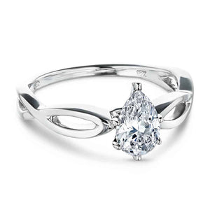 Unique solitaire engagement ring with a 1ct pear cut lab grown diamond in twisted metal design 16k white gold band