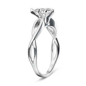 Solitaire engagement ring with a 1ct pear cut lab grown diamond in twisted metal design 16k white gold band shown from side