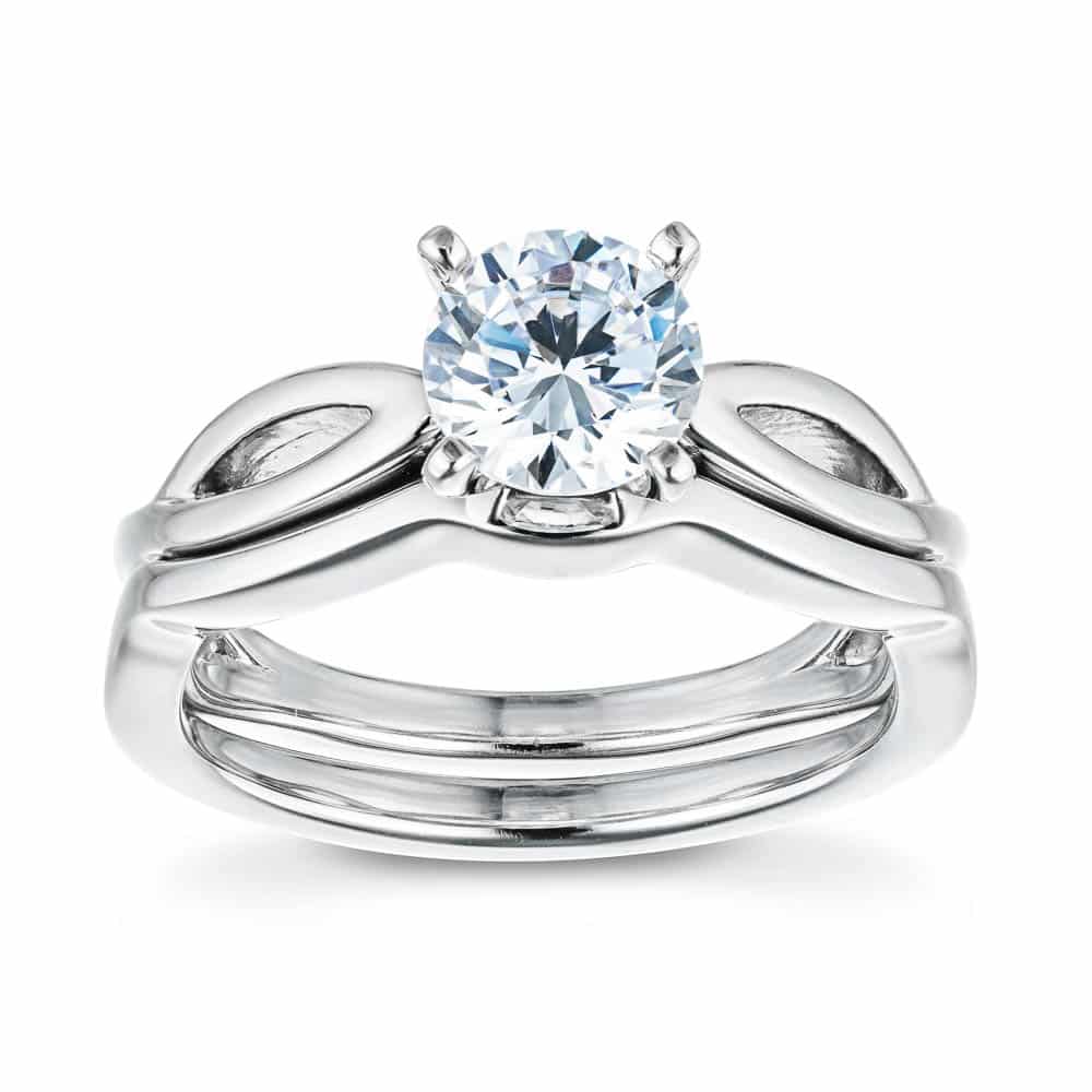 Shown with a 1.0ct Round cut Lab-Grown Diamond in recycled 14K white gold with matching wedding band