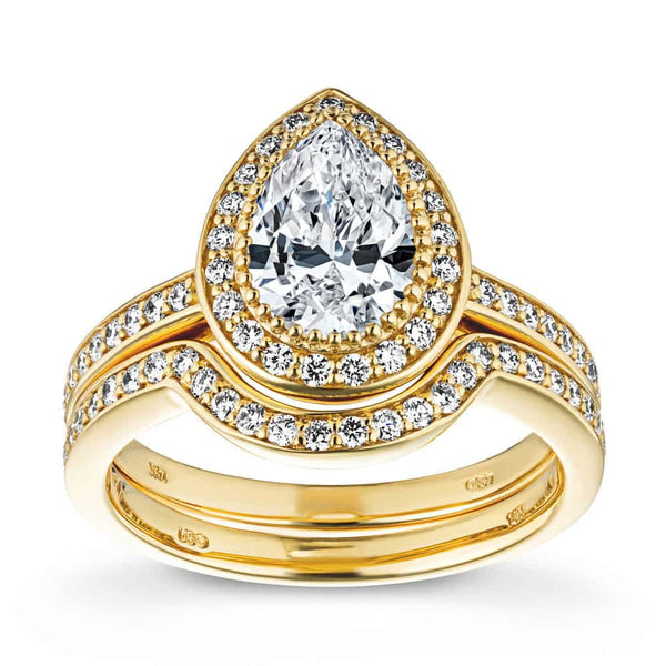 Shown with a 1.0ct Pear cut Lab-Grown Diamond with a diamond accented halo and band in recycled 14K yellow gold with matching wedding band | french engagement ring Shown with a 1.0ct Pear cut Lab-Grown Diamond with a diamond accented halo and band in recycled 14K yellow gold matching wedding band