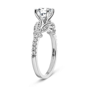 Nature inspired floral engagement ring with peek-a-boo diamonds and a 1ct round cut lab created diamond in 14k white gold shown from side