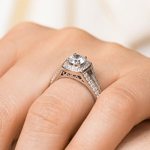 Beautiful antique style two tone diamond accented split shank halo engagement ring with 0.5ct round cut lab grown diamond in 14k white gold worn on hand