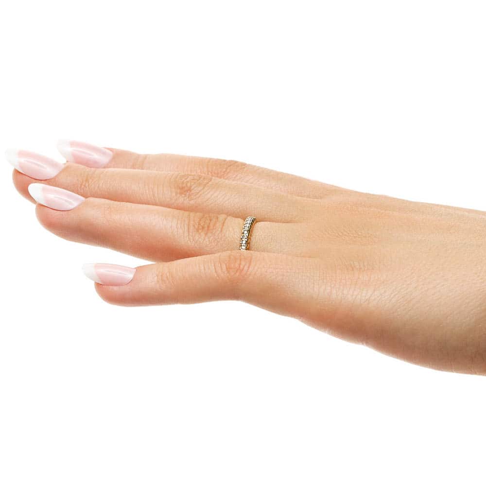 Diamond accented wedding band in recycled 14K yellow gold 