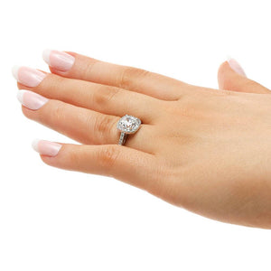 Diamond accented halo engagement ring with 1ct cushion cut lab grown diamond in 14k white gold worn on hand sideview