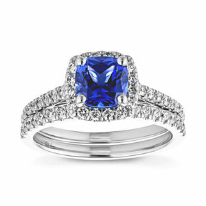 Unique diamond accented halo wedding ring set with cushion cut lab created blue sapphire in 14k white gold