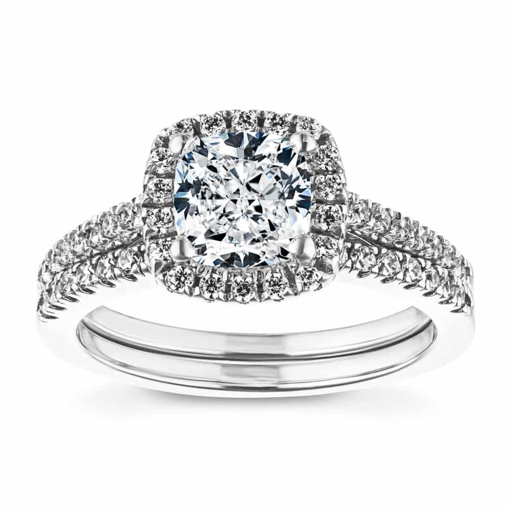 Shown with a 1.0ct Cushion cut Lab-Grown Diamond with a diamond accented halo and diamonds accenting the band in recycled 14K white gold with matching band, purchase the set for a discount | diamond halo accented engagement ring Shown with a 1.0ct Cushion cut Lab-Grown Diamond with a diamond accented halo and diamonds accenting the band in recycled 14K white gold with matching band