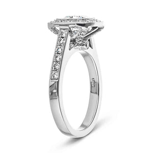 Antique style diamond accented halo engagement ring with peek-a-boo diamonds in 14k white gold show from side