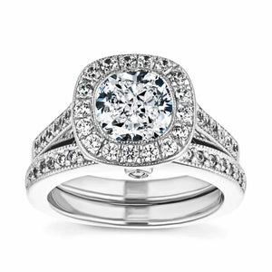  antique vintage engagement ring Shown with a 1.0ct Cushion cut Lab-Grown Diamond with a diamond accented and filigree detailed halo and accenting diamonds on the band in recycled 14K white gold with matching wedding band