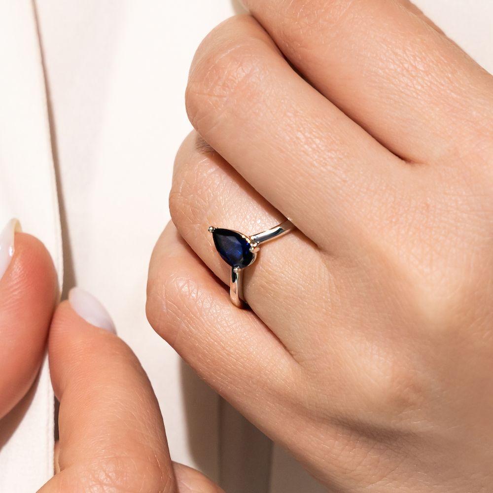 Shown with 1ct Pear Cut Lab Grown Blue Sapphire in 14k White Gold