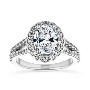 Beautiful nature inspired floral halo engagement ring with diamond accented split shank holding a 1ct oval cut lab grown diamond in 14k white gold