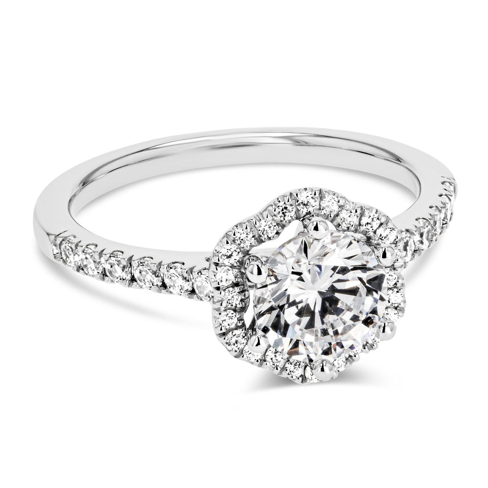 Shown here with a 1.0ct Round Cut Lab Grown Diamond center stone in 14K White Gold|diamond accented halo engagement ring with lab grown diamond center stone set in 14k white gold recycled metal