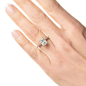 Diamond accented solitaire engagement ring with 1ct radiant cut lab grown diamond in 14k white gold worn on hand