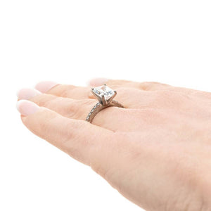 Diamond accented solitaire engagement ring with 1ct radiant cut lab grown diamond in 14k white gold worn on hand sideview