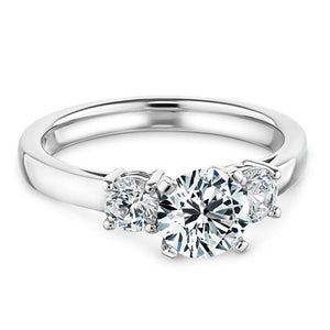 Elegant three stone ring with 1ct round cut lab grown diamond and two diamond shoulder stones in 14k white gold