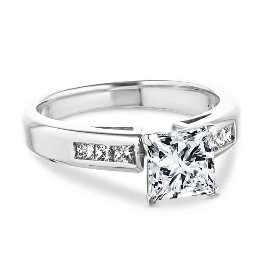 Shown with 1ct Princess Cut Lab Grown Diamond in 14k White Gold|Beautiful engagement ring with cathedral style 1ct princess cut lab grown diamond in channel set diamond accented 14k white gold band