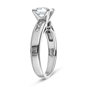 Cathedral style engagement ring with 1ct princess cut lab diamond in channel set diamond accented 14k white gold band shown from side