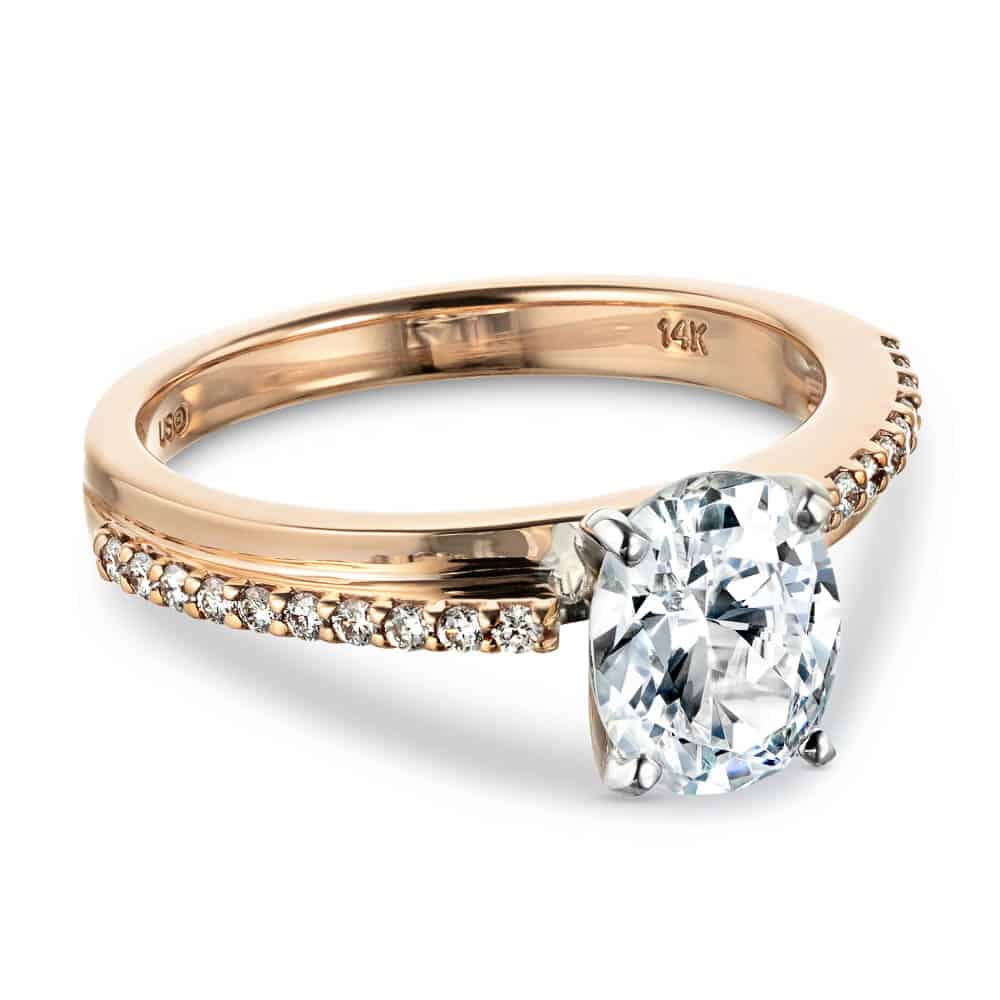 Shown with 1.5ct Oval Cut Lab Grown Diamond in 14k Rose Gold|Beautiful unique engagement ring with asymmetrical pave set accenting diamonds set with 1.5ct oval cut lab grown diamond in 14k rose gold band