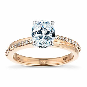 Stunning unique engagement ring with asymmetrical rows of pave set accenting diamonds set with 1.5ct oval cut lab grown diamond in 14k rose gold band