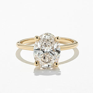 Ethical hidden halo engagement ring with 4 prong set 3ct oval cut lab grown diamond in a thin 14k yellow gold band