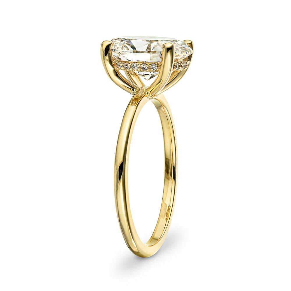 Shown with 3ct Oval Cut Lab Grown Diamond in 14k Yellow Gold|Elegant hidden halo engagement ring with 4 prong set 3ct oval cut lab grown diamond in thin 14k yellow gold band