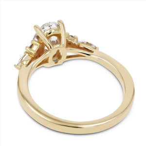 Diamond accented engagement ring with a 1ct oval cut lab grown diamond set in 14k yellow gold