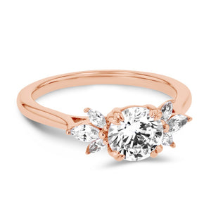 floral inspired diamond accented engagement ring with round cut lab grown diamond center stone set in 14k rose gold metal