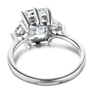 Three stone engagement ring with 2ct emerald cut lab grown diamond center stone with triangle side stones set in 14k white gold band shown from back