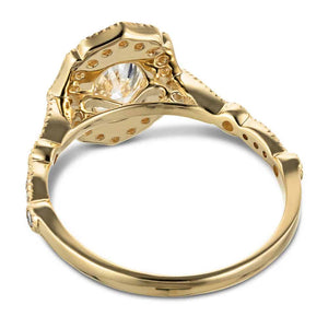 Vintage style diamond accented halo engagement ring with a 1ct oval cut lab grown diamond set in 14k yellow gold shown from back