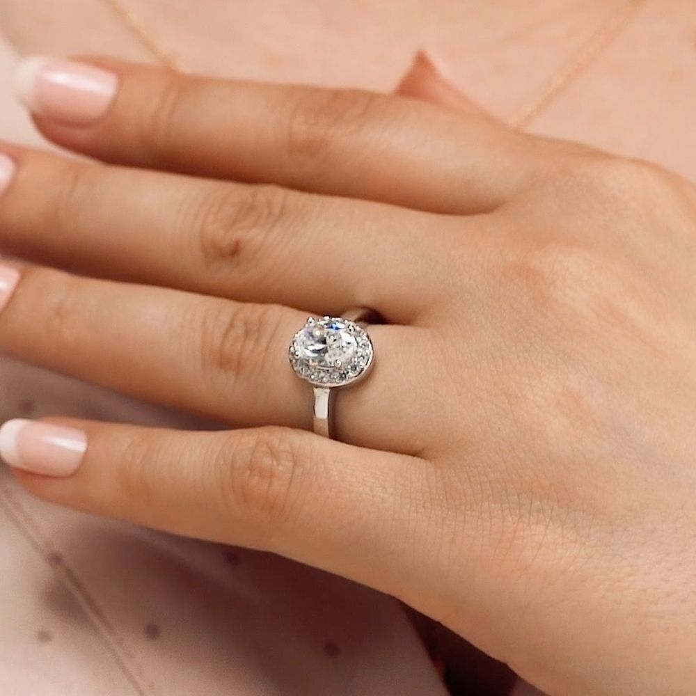 Shown with 1ct Oval Cut Lab Grown Diamond in Platinum|Unique ethical pave set diamond accented halo engagement ring with 1ct oval cut lab grown diamond in platinum setting