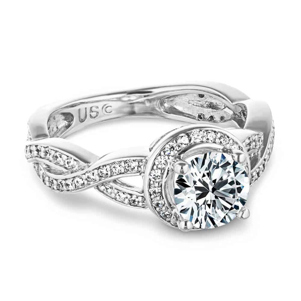 Shown with a 1.0ct Round cut Lab-Grown Diamond with a diamond accented halo and twisted band in recycled 14K white gold 