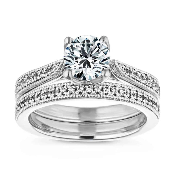 Shown with a 1.0ct Round cut Lab-Grown Diamond with diamonds accenting the band and filigree details in recycled 14K white gold with matching wedding band, can be purchased together for a discounted price| wedding set two tone Shown with a 1.0ct Round cut Lab-Grown Diamond with diamonds accenting the band and filigree details in recycled 14K white gold with matching wedding band
