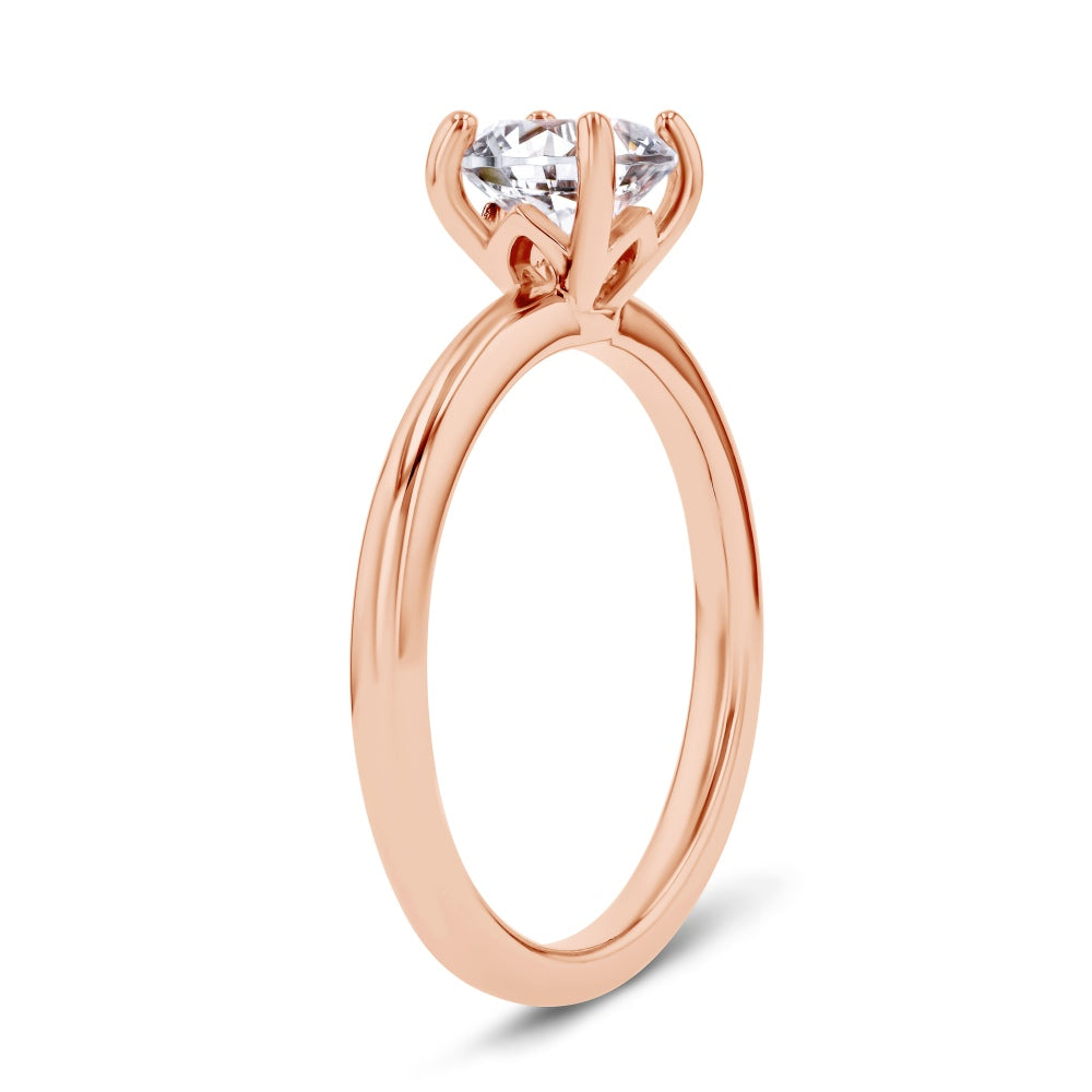 Shown here with a 1.0ct Round Cut Lab Grown Diamond center stone in 14K Rose Gold|shown with 1 carat lab grown diamond center stone with nature inspired floral prong head set in 14k rose gold