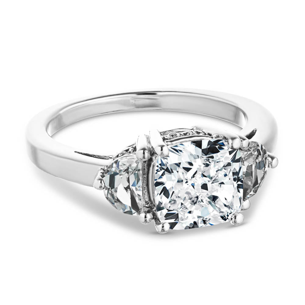 Shown with 2ct Cushion Cut Lab Grown Diamond Center & 0.50ct Moon Cut Side Stones in 14k White Gold|Unique beautiful three stone engagement ring with 2ct cushion cut lab grown diamond center with two moon cut side stones in accented basket style head in 14k white gold setting