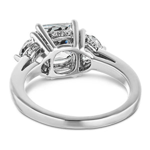 Three stone engagement ring with 2ct cushion cut lab grown diamond center with two moon cut side stones in accented basket style head in 14k white gold shown from back