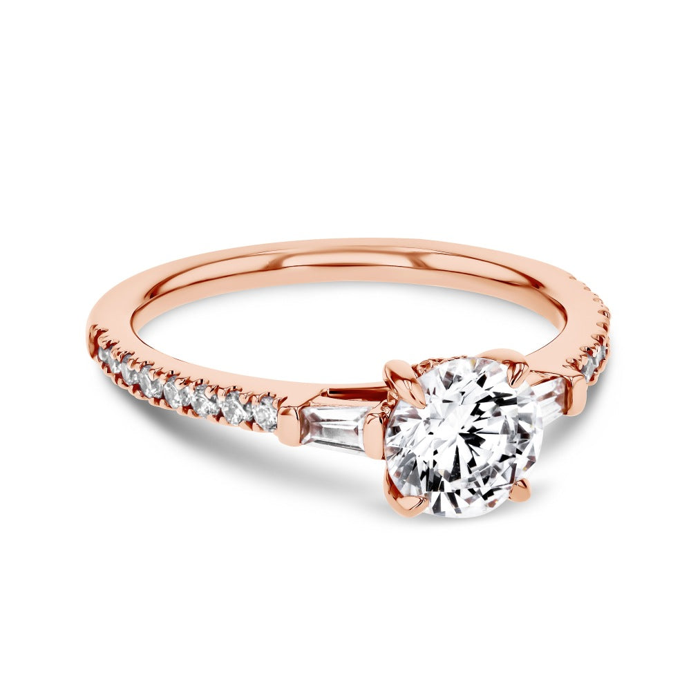 Shown here with a 1.0ct Round Cut Lab Grown Diamond center stone in 14K Rose Gold|diamond accented engagement ring with round cut lab grown diamond center stone set in 14k rose gold metal