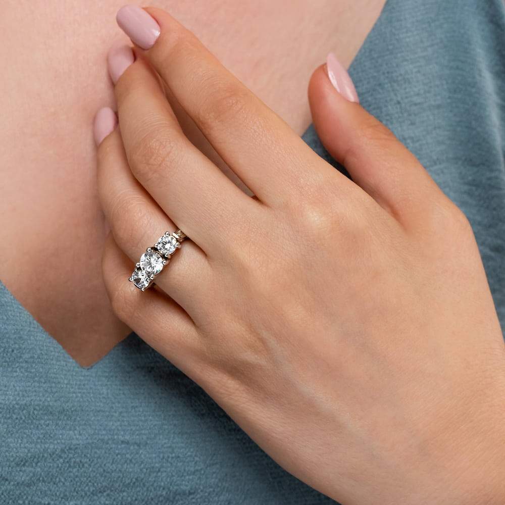 Shown with 3 Round Cut Lab Grown Diamonds in 14k White Gold|Unique vintage style three stone engagement ring with round cut lab grown diamonds in 14k white gold band with filigree detailing