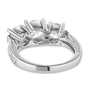 Vintage style three stone engagement ring with round cut lab created diamonds in 14k white gold setting with filigree detailing shown from back