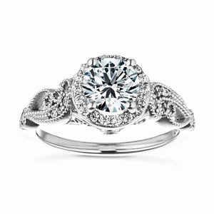 Unique vintage style diamond accented halo engagement ring with 1ct round cut lab created diamond with milgrain and filigree detailing in two tone 14k white gold