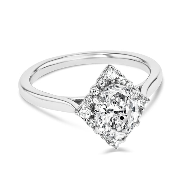 Shown here with a 1.0ct Oval Cut Lab Grown Diamond center stone in 14K White Gold|kite shaped diamond halo engagement ring with oval cut lab grown diamond center stone set in 14k white gold metal
