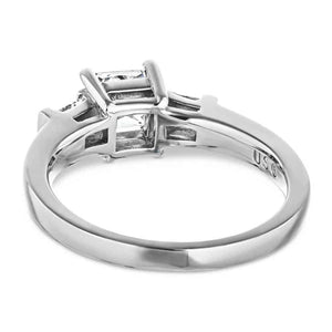 Three stone engagement ring with 1ct princess cut lab created diamond and two tapered baguette side stones in cathedral style 14k white gold setting shown from back
