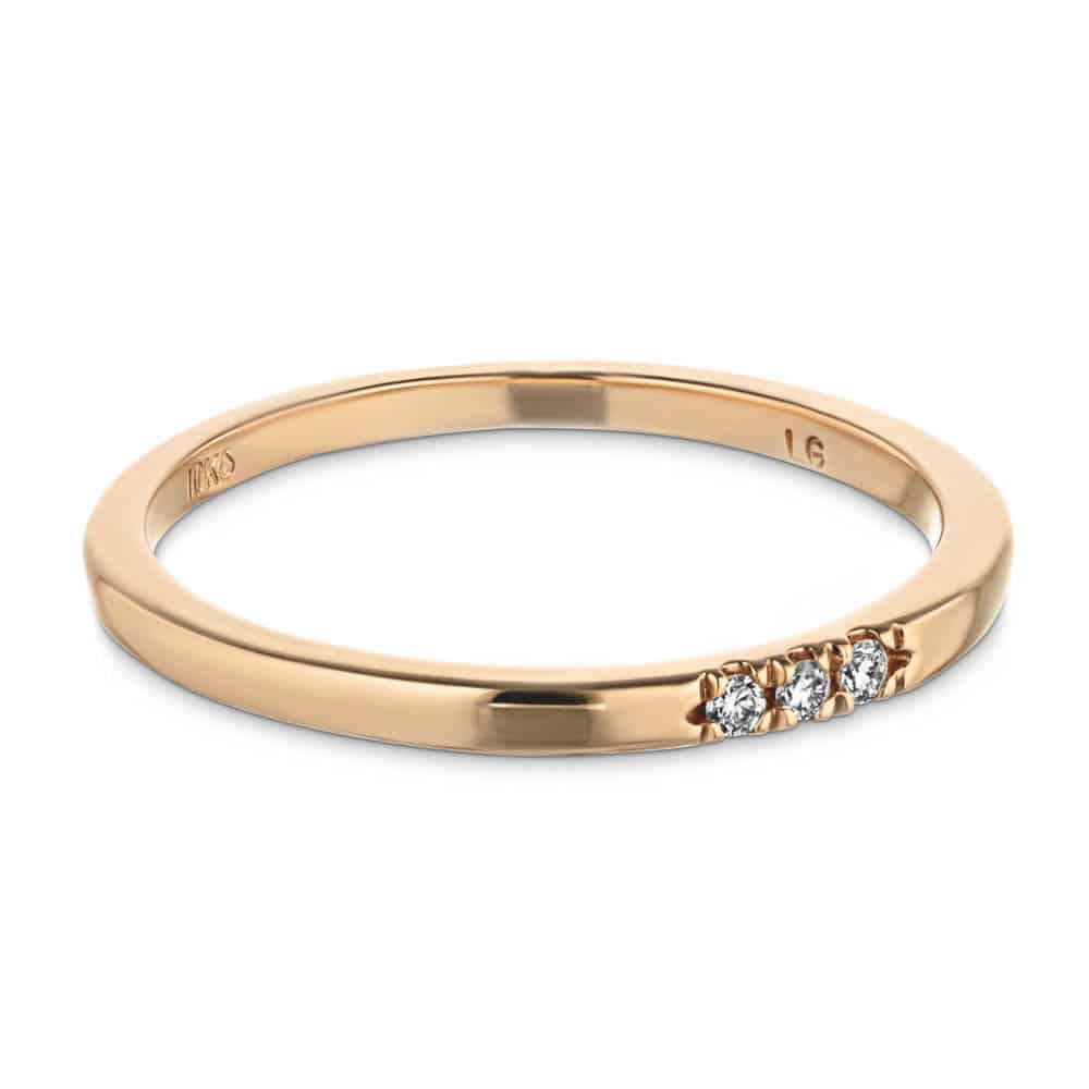 Three Lab-Grown Diamonds set in a simple band in recycled 10K rose gold 
