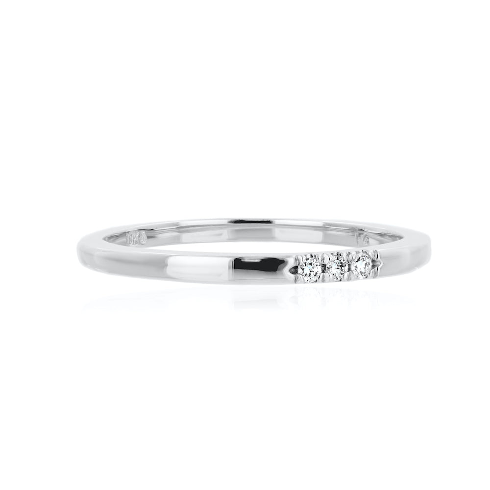 Three Lab-Grown Diamonds set in a simple band in recycled 10K white gold 