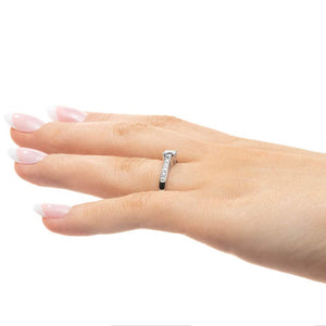 Diamond accented engagement ring with 0.5ct round cut lab grown diamond in 14k white gold band worn on hand sideview