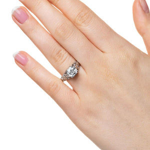 Antique style engagement ring with 1ct cushion cut lab grown diamond in detailed 14k white gold worn on hand