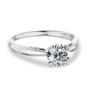 Simple classic solitaire engagement ring with 1ct round cut lab grown diamond in cathedral style 14k white gold setting