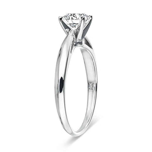 Solitaire engagement ring with 1ct round cut lab grown diamond in cathedral style 14k white gold band shown from side
